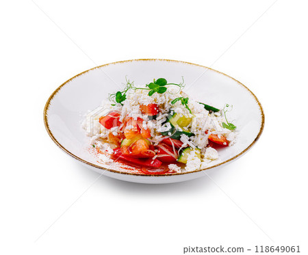Shopska salad served on white plate with microgreens decoration 118649061