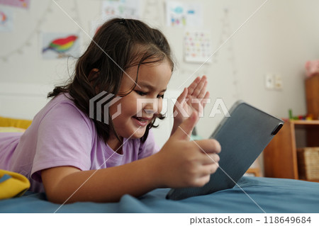 Girl Having Video Call On Tablet PC Girl Having Video Call On Tablet PC 118649684