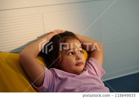 Little Girl Resting In Her Bed 118649835