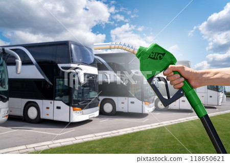 Biofuel filling station on a background of buses. Decarbonization of transport. 118650621