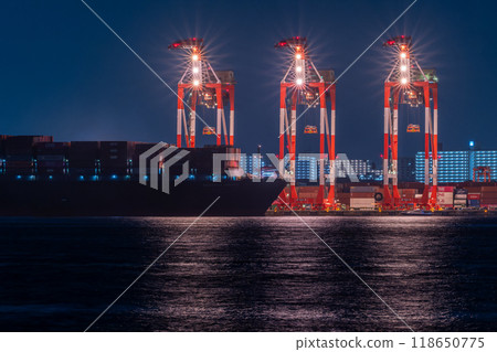 Night port scene with cranes, container ships and loading vessels Night port scene with cranes, container ships and loading vessels 118650775