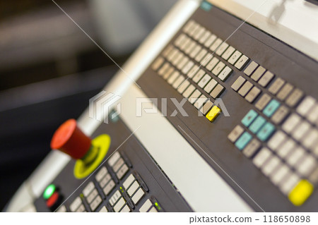 Control panel of cnc turning milling lathe machine at factory, plant, red emergency switch button on foreground Control panel of cnc turning milling lathe machine at factory, plant, red emergency switch button on foreground 118650898