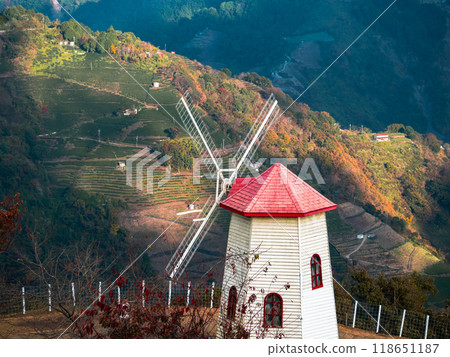Red roof windmill and beautiful mountains 118651187