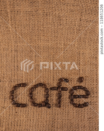 Coffee beans spell out the word cafe Coffee beans spell out the word cafe 118651206