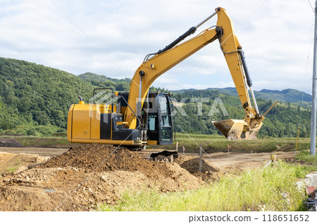 Hydraulic excavator at infrastructure development site 118651652