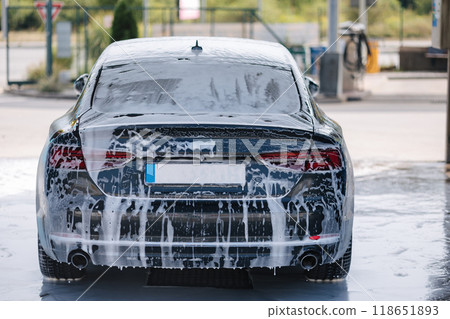 Luxury car all in white foam on self service car wash. Waiting. Back view  118651893