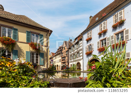 Picturesque old town of Eguisheim in Alsace, on Alsace Wine Route, Haut-Rhin, Grand Est, France, with fountain, traditional and half-timbered houses 118653295