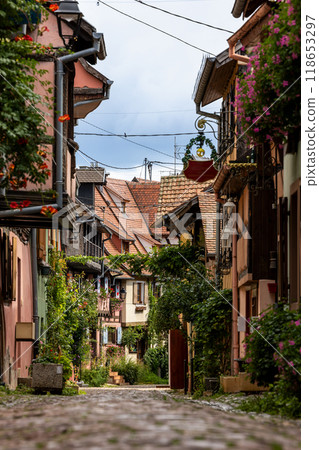 Old half-timbered houses in the historic medieval old town of Eguisheim in Alsace and on Alsace Wine Route, Haut-Rhin, Grand Est, France, Europe Old half-timbered houses in the historic medieval old town of Eguisheim in Alsace and on Alsace Wine Route, Haut-Rhin, Grand Est, France, Europe 118653297