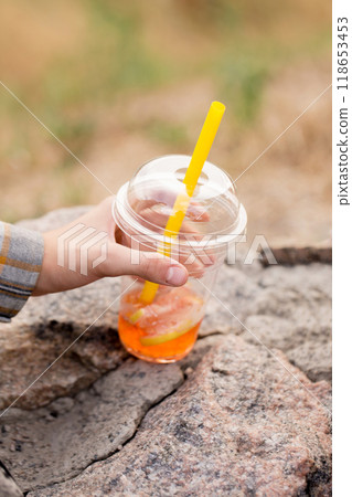 Two drink bubble tea in children's hands, close-up Two drink bubble tea in children's hands, close-up 118653453