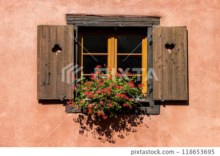 Rustic flower-decorated window in the historic old town of Eguisheim in Alsace, on the Alsace Wine Route, Haut-Rhin, Grand Est, France, Europe Rustic flower-decorated window in the historic old town of Eguisheim in Alsace, on the Alsace Wine Route, Haut-Rhin, Grand Est, France, Europe 118653695
