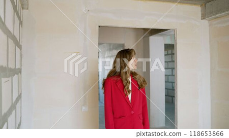 Real estate agent inspecting new property construction site Real estate agent inspecting new property construction site 118653866