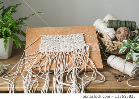 Macrame workspace in a cozy home workshop 118653923