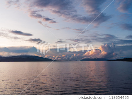 panoramic aerial view of sunrise over the sea and mountains with clouds 118654465
