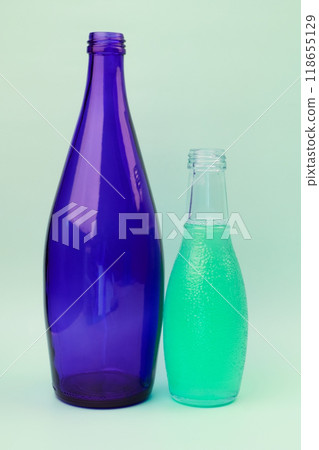 Colorful glass bottle, unusual background 118655129