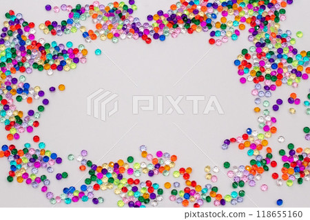 Multicolored tiny faceted crystals on a white background, beautiful colorful texture 118655160