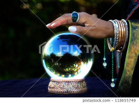 Crystal ball and fortune teller's hand 118655749