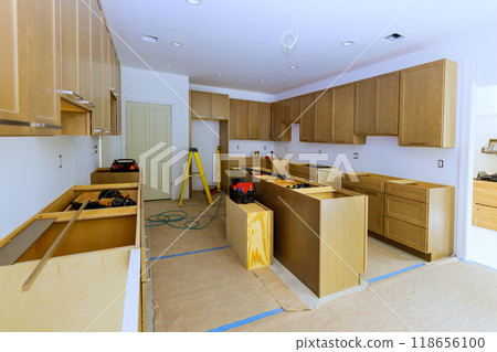 Construction of new kitchen cabinet during home improvement project Construction of new kitchen cabinet during home improvement project 118656100