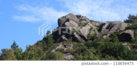 Rock formation in Egersund surrounded by forest, Norway. 118656475