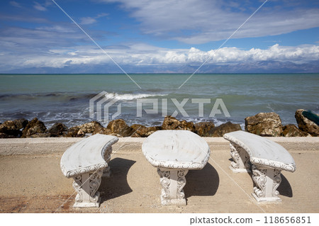 Stone table and bench on the coast, Corfu, Greece 118656851