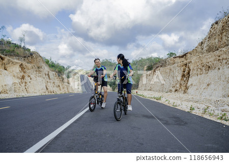 couple biker enjoying biking together mountain 118656943