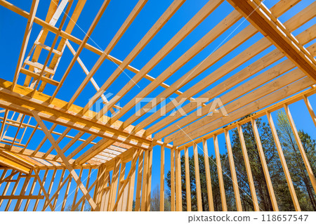 Construction new house included installation of ceiling rafter framework beams Construction new house included installation of ceiling rafter framework beams 118657547
