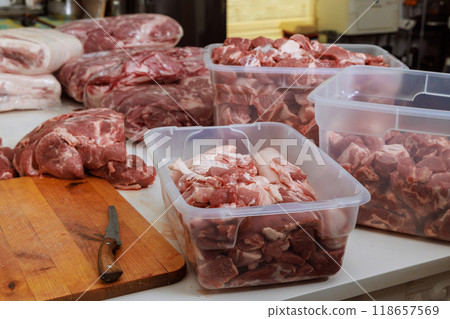 Pork meat that has been raw is prepared for marinating before being grilled on barbecue BBQ 118657569