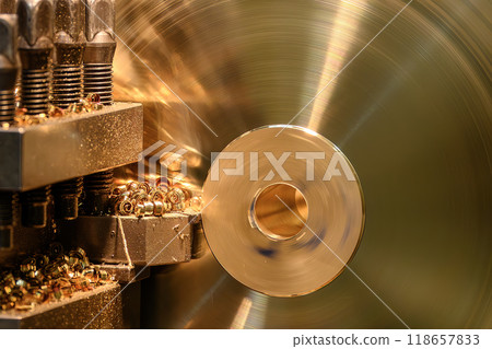 The lathe machine finish cut the brass material parts with continue chips. The lathe machine finish cut the brass material parts with continue chips. 118657833