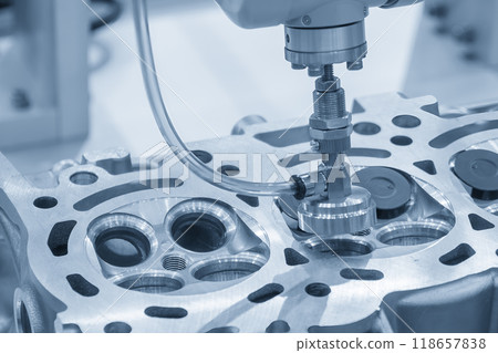 The intake and exhaust vale assembly process by robotic system in the light blue scene. 118657838