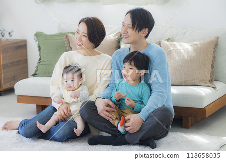 A family relaxing in the living room A family relaxing in the living room 118658035