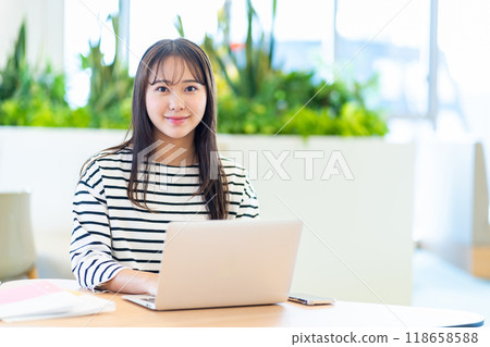 College students using laptops in a cafe. Photo courtesy of Denpa Gakuen, Tokyo Electronics College. College students using laptops in a cafe. Photo courtesy of Denpa Gakuen, Tokyo Electronics College. 118658588