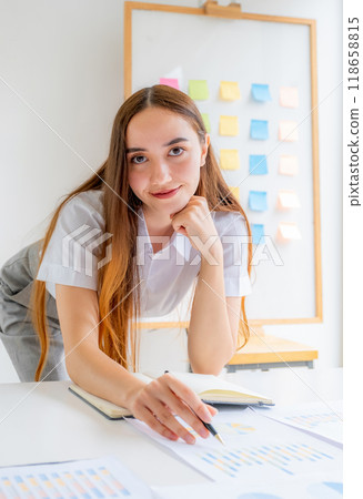 Caucasian businesswoman management work plan strategies to increase business income. Have a finance graph analysis of the new target success 118658815