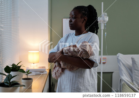 Caring for Newborn Baby in Hospital Room 118659137