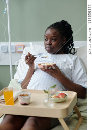 Eating Breakfast While Sitting in Hospital Bed Eating Breakfast While Sitting in Hospital Bed 118659323