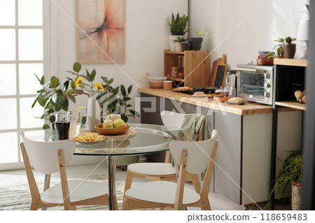 Three chairs surrounding kitchen table Three chairs surrounding kitchen table 118659483
