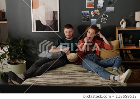 Eating popcorn and watching movie Eating popcorn and watching movie 118659512