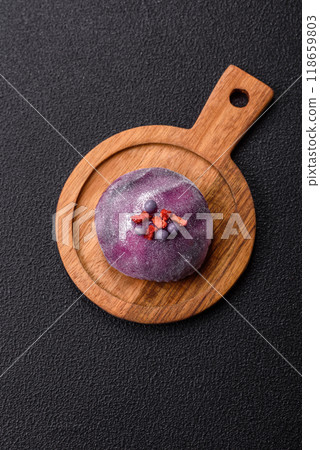 Delicious cold Japanese mochi dessert with colorful rice dough shell and fruit filling 118659803
