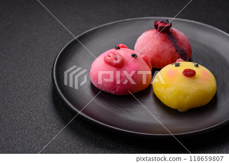 Delicious cold Japanese mochi dessert with colorful rice dough shell and fruit filling 118659807