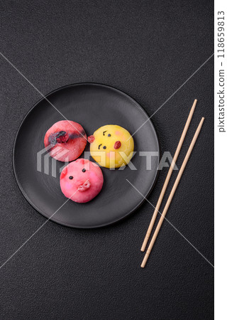 Delicious cold Japanese mochi dessert with colorful rice dough shell and fruit filling 118659813