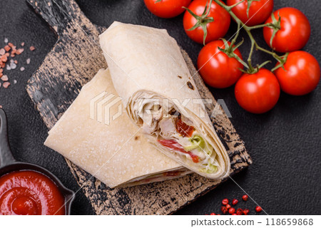 Delicious traditional shawarma or doner kebab with chicken Delicious traditional shawarma or doner kebab with chicken 118659868