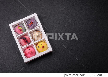 Delicious cold Japanese mochi dessert with colorful rice dough shell and fruit filling 118659898