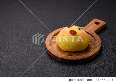 Delicious cold Japanese mochi dessert with colorful rice dough shell and fruit filling 118659903