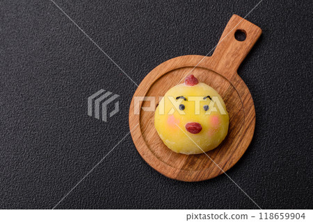 Delicious cold Japanese mochi dessert with colorful rice dough shell and fruit filling 118659904