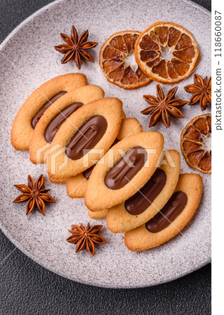 Delicious sweet crispy cookies with chocolate filling in the center Delicious sweet crispy cookies with chocolate filling in the center 118660087