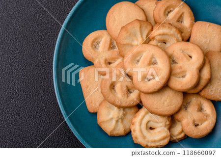 Delicious fresh sweet crispy butter cookies on a dark background 118660097