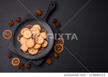 Delicious fresh sweet crispy butter cookies on a dark background Delicious fresh sweet crispy butter cookies on a dark background 118660122