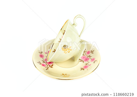 Vintage porcelain cup and saucer isolated on white. 118660219