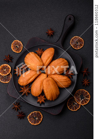 Traditional French madeleine biscuits with nutty flavor Traditional French madeleine biscuits with nutty flavor 118660312