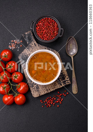 Delicious hot tomato soup with vegetables, vegan, vegetarian food Delicious hot tomato soup with vegetables, vegan, vegetarian food 118660363