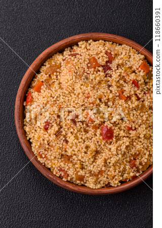 Delicious hot boiled wheat porridge couscous with vegetables Delicious hot boiled wheat porridge couscous with vegetables 118660391