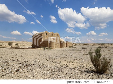 Quseir (Qasr) Amra desert castle (against the sky with clouds) near Amman, Jordan. World heritage with famous fresco's. Built in 8th century, of early Islamic art and architecture Quseir (Qasr) Amra desert castle (against the sky with clouds) near Amman, Jordan. World heritage with famous fresco's. Built in 8th century, of early Islamic art and architecture 118660558